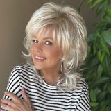 All over cascading wavy layers and a textured bang wig