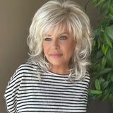 All over cascading wavy layers and a textured bang wig